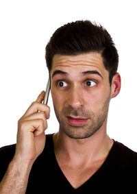 Close-up portrait of young man against white background