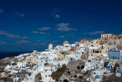 Cityscape against blue sky