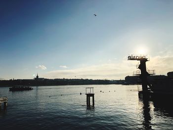 View of pier on lake against sky