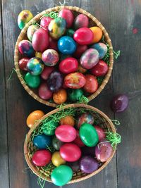 Directly above view of multi colored easter eggs in basket