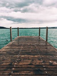 Pier over sea against sky