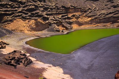 High angle view of rock formation in lake