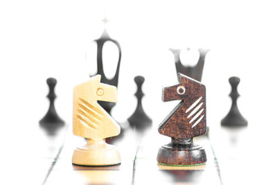 Close-up of chess board against white background