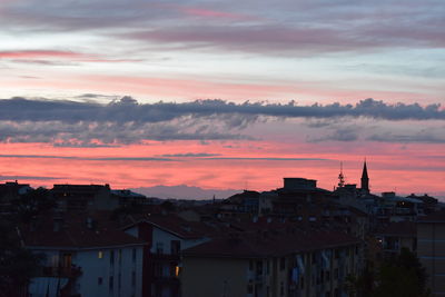 High angle view of townscape against orange sky