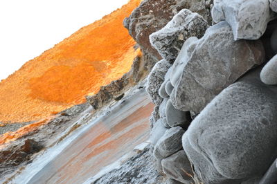 Scenic view of rocks in sea against sky