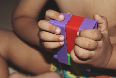 Close-up of baby holding hands
