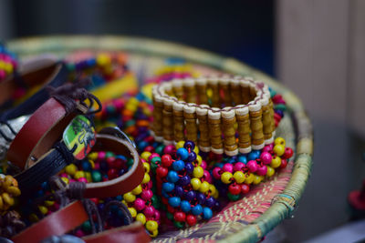 Close-up of multi colored bracelets in basket
