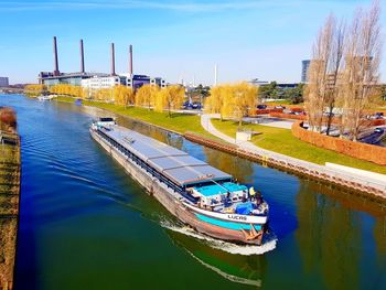 Boats moored in river against sky