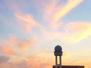 Scenic view of water tower against sky during sunset