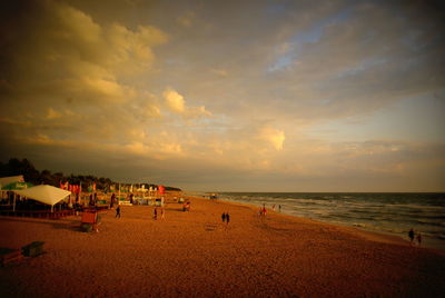 Scenic view of beach against sky during sunset