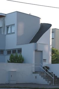 Staircase by building against clear sky