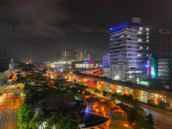 High angle view of illuminated buildings in city at night