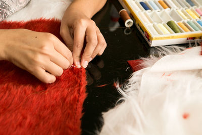 Midsection of woman working in traditional clothing