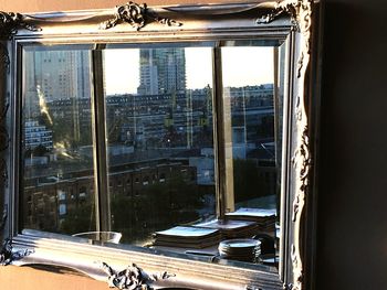Reflection of buildings on glass window