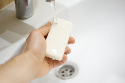 Midsection of person holding ice cream