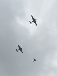 Low angle view of airplane flying in sky