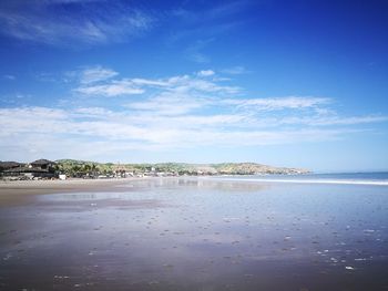 View of beach against blue sky