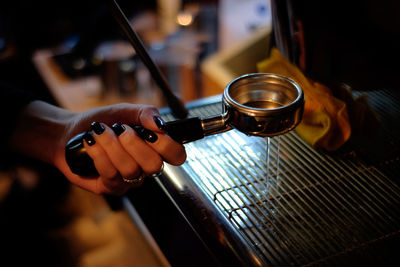 Close-up of hand holding tea cup