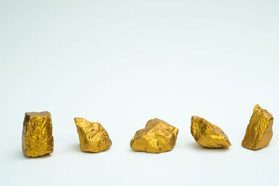 Close-up of candies against white background