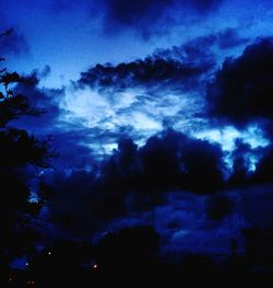 Low angle view of cloudy sky at night