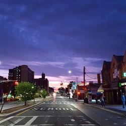 City street against cloudy sky