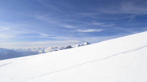 Snow covered mountains against sky