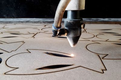 Close-up of cnc machine over sheet metal 