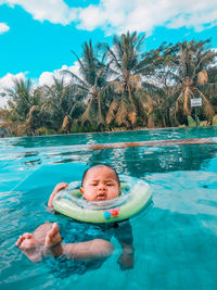 Boy swimming in pool