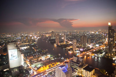 High angle view of illuminated cityscape at night