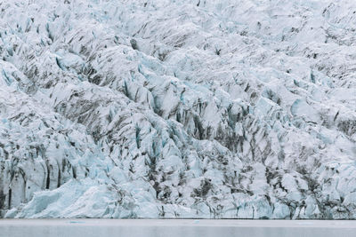 Icebergs by sea during winter