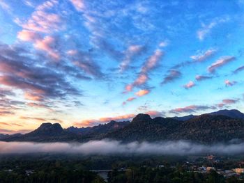 Scenic view of mountains against sky during sunset