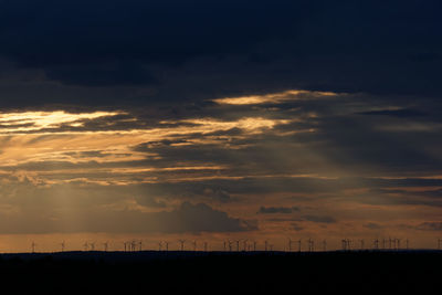 Scenic view of silhouette landscape against sky during sunset