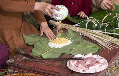 Midsection of man preparing food