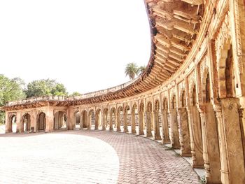 Arcade of historical building against sky