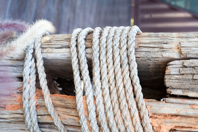 Close-up of rope tied on wood