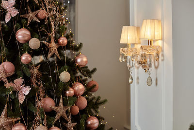 Close-up of illuminated christmas tree at home
