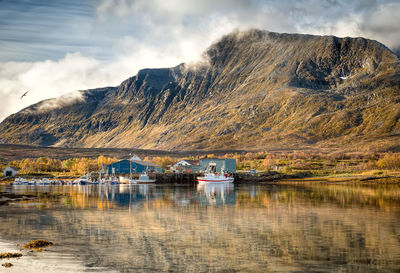 Scenic view of lake against cloudy sky