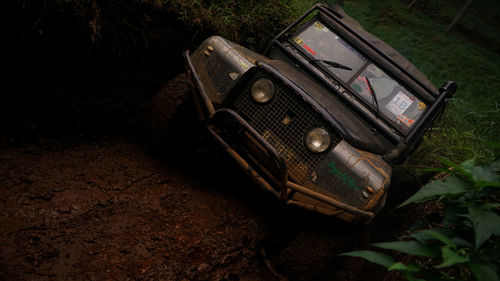 High angle view of abandoned car on land