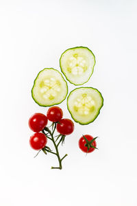 Close-up of tomatoes against white background