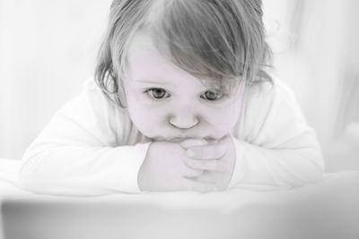 Close-up portrait of cute girl at home