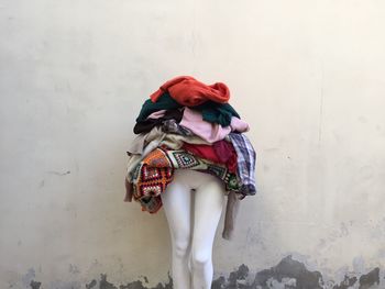 Clothes on mannequin against wall