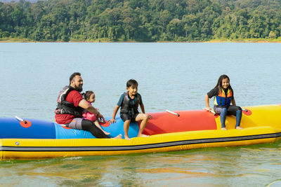 People on boat in lake