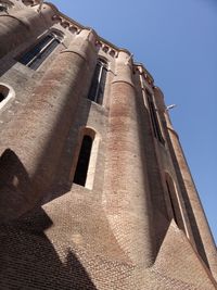 Low angle view of building against clear blue sky