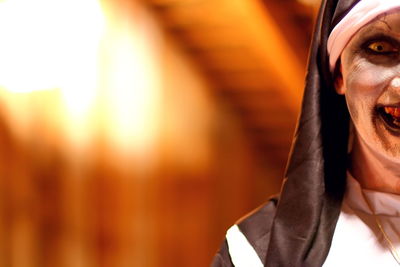 Portrait of woman wearing spooky nun costume
