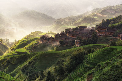 High angle view of town on houses during foggy weather