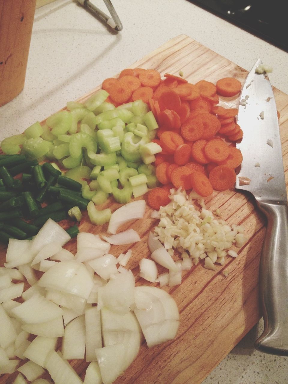 food and drink, food, freshness, indoors, healthy eating, still life, table, high angle view, vegetable, cutting board, fruit, wood - material, variation, slice, raw food, close-up, large group of objects, kitchen knife, basket, no people