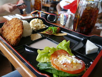 Close-up of served food on tray