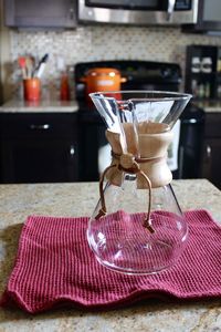 Close-up of wine glasses on table