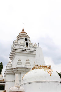 Low angle view of bell tower against sky