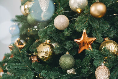 Christmas tree decor with baubles and stars, close up. christmas tree banner for christmas tree